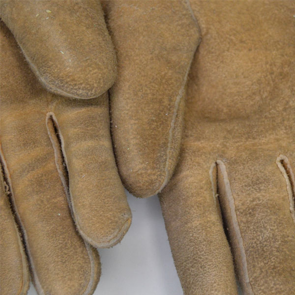 Beaded leather gauntlets with a floral and deer motif.