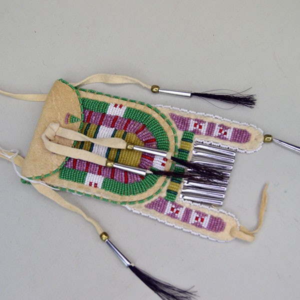 Front view of a green Arapaho style strike a lite bag.