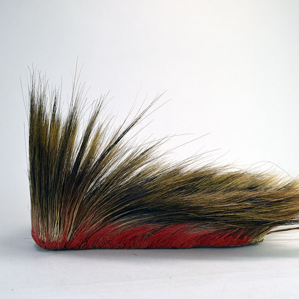 Antique hair base roach with red deer hair.