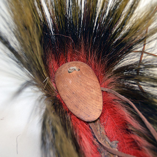 Antique hair base roach with red deer hair close up of top view.
