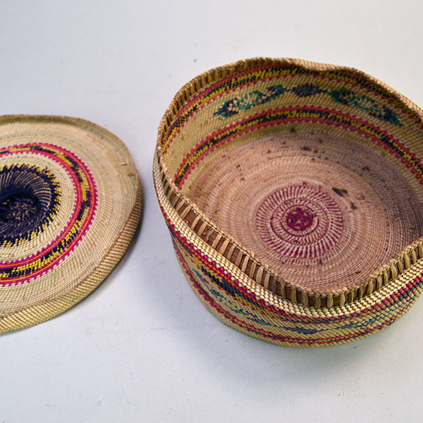 Pictured here is the inside of the lid and body of the large antique Nootka-style basket, revealing its finely twined interior and traditional craftsmanship