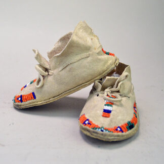 You will love these tiny Moccasins- Infant Beaded Orange! They were made from Braintanned Deerskin Leather, and Raw Hide soles. One of a Kind.