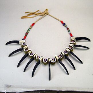 Wear this Necklace- Bear Claw 3" to your next event or add it to your collection! The beaded portion spans approximately 28 inches. One of a Kind.