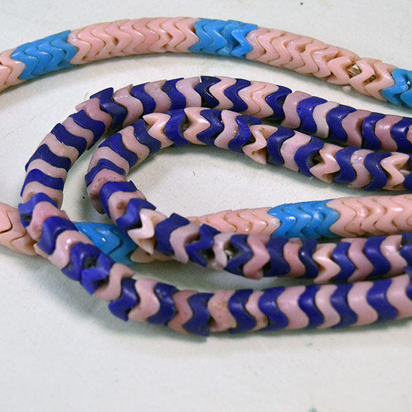 Pictured here is a close-up of the Snake Beads Lot, featuring 8mm beads in varying thicknesses that highlight their distinctive texture and craftsmanship.