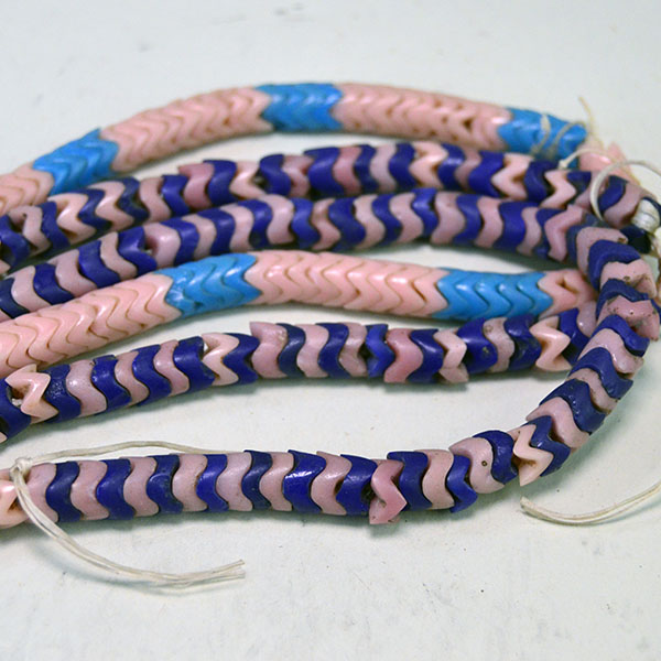 Pictured here is a close-up of the Snake Beads Lot, featuring 8mm beads in varying thicknesses that highlight their distinctive texture and craftsmanship.