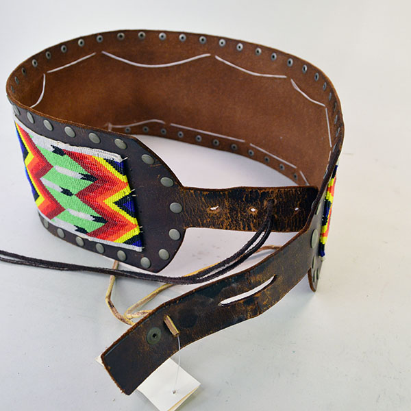 Add this vintage handcrafted belt—beaded in a feather design—to your collection. Measuring 31.5 inches long and 5 inches wide. one of a kind