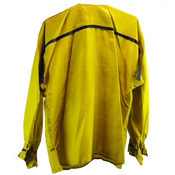 This mustard yellow silk ribbon shirt is accented with bold black ribbon trim, elegantly showcasing the back