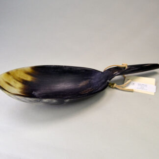 This large cow horn spoon showcases impressive craftsmanship, with the spoon section measuring 7.75 inches long by 3.75 inches wide. One of a Kind.