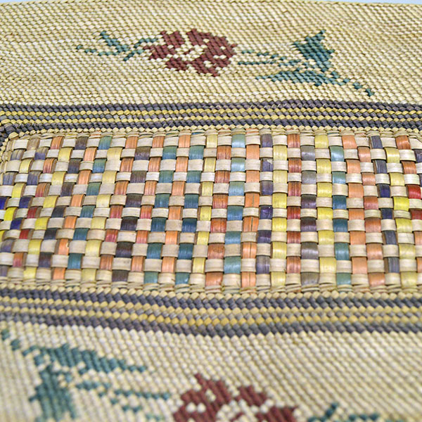 This Antique Basket- Nootka Style XL with a cover will make an ideal addition to your collection! stands 4.5″ tall with the lid on and 12.5″ long. Pictured here is the top of the cover show casing the flowers and the weave on the cover.