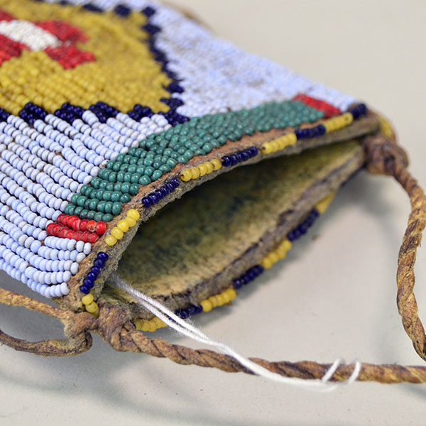 This fully beaded Northern Plains style Knife Sheath- Light Blue will make a great addition to your collection! One of a Kind. Pictured here is the opening of the sheath.