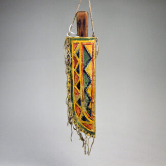 This striking Knife Sheath- Rawhide Painted Northern Plains Style features hand painted geometric design.  Measuring 11″ × 3.75″ One of a Kind.