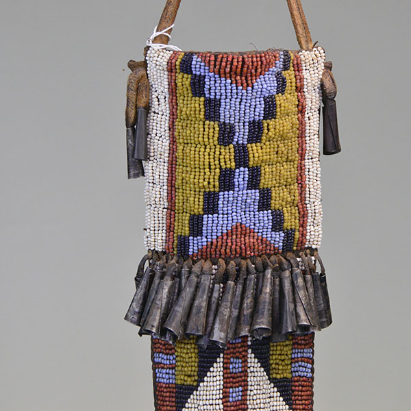 This fully beaded Northern Plains style Knife Sheath- Squared Ended will make a great addition to your collection! One of a Kind. Pictured here is the top of the sheath and the tin cones.
