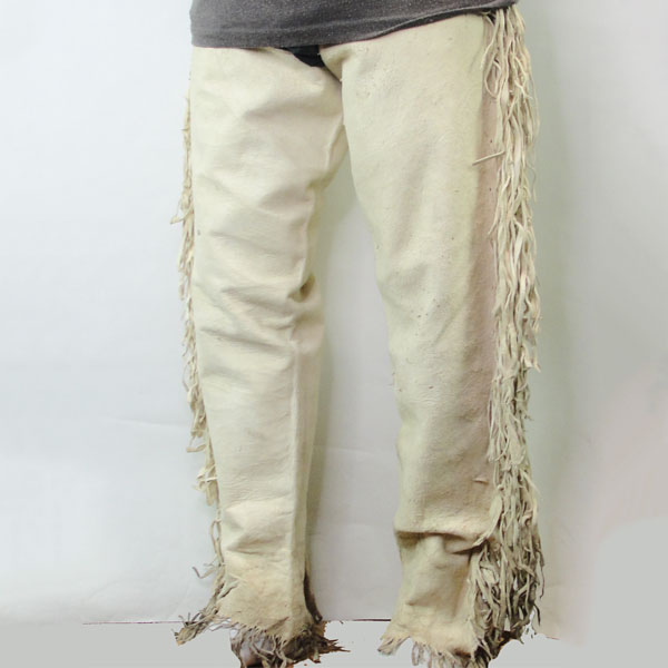 These soft Leggins- Men's Large White feature side fringe. The crafter made them with soft, Sheep Skin leather. One of a Kind. pictured here is the sideview.