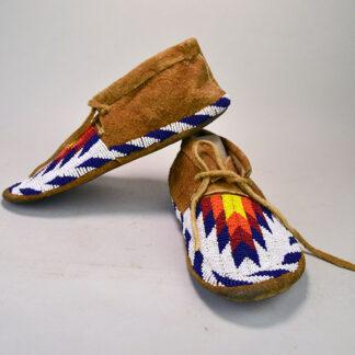 Step into tradition with these stunning Northern Plains-style Moccasins- Beaded Brown Leather. Approximately 9.75″ long x 3" wide, one of a kind