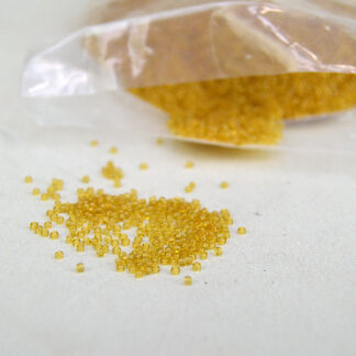 Elevate your beadwork with these Seed Beads- Transparent Amber 13/0. Made in France and packaged in a generous 15 ounces, an estimated 79,000 beads.