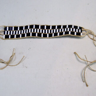 This Wampum Bracelet- 3 row features white and cobalt blue glass wampum beads. The crafter used hemp lacing to string the rows.