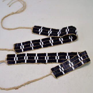 These Wampum Garters- 3 row are constructed with white and blue glass wampum beads. The crafter uses durable hemp lacing.
