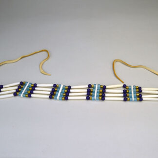 four row Choker- No Drop comes with 1.5 inch Bone Hairpipe. smoked color deerskin leather lacing. Crow beads, round glass beads, and Bone Choker Spacers.