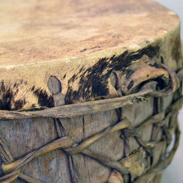 Old Log Drum, 16" x 7.5". Crafted from a single old log, this pre‑1900 drum is a rare survivor and remains in impressive condition for its age. pictured here is the brown hair still on the rawhide.