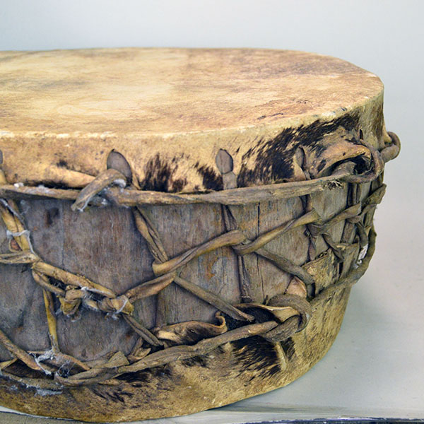 Old Log Drum, 16" x 7.5". Crafted from a single old log, this pre‑1900 drum is a rare survivor and remains in impressive condition for its age. Pictured here is the side of the drum.