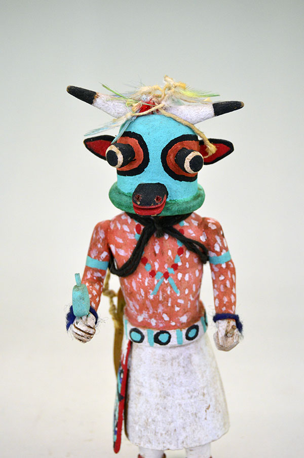 This Katsina- Hopi Cow delivers standout presence and authentic craftsmanship. It stands 8.75 inches tall and 3.5 inches wide. one of a kind. pictured here is the front , showing the face and the body painting.