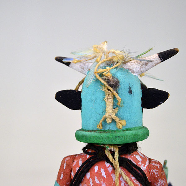 This Katsina- Hopi Cow delivers standout presence and authentic craftsmanship. It stands 8.75 inches tall and 3.5 inches wide. one of a kind. pictured here is the back of the head.