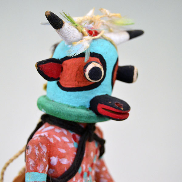 This Katsina- Hopi Cow delivers standout presence and authentic craftsmanship. It stands 8.75 inches tall and 3.5 inches wide. one of a kind. pictured here is the side of the face.