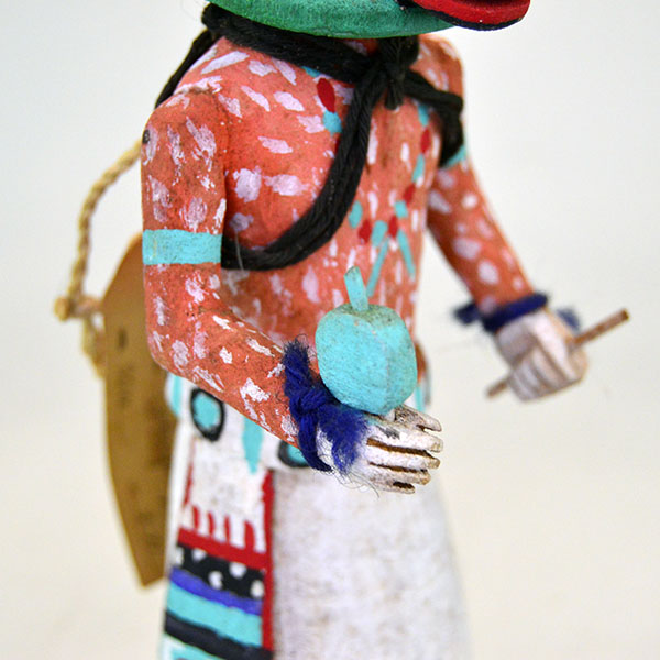 This Katsina- Hopi Cow delivers standout presence and authentic craftsmanship. It stands 8.75 inches tall and 3.5 inches wide. one of a kind. pictured here is the rattle in the hand, and the painted figure.