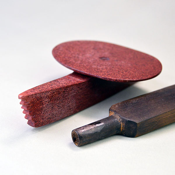 striking centerpiece to your collection with this impressive Peace Pipe- Catlinite Disk. the piece measures a full 22.5 inches. One of a Kind. pictured here is the Catlinite disk end and the wooden pipe stem.