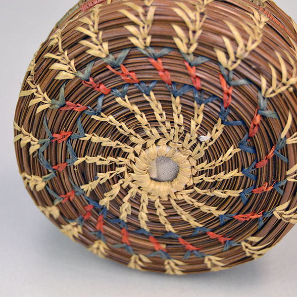 Pincushion- Basket Seminole Style makes a charming vintage addition to any sewing collection or display. stands 2.25 inches tall and 3.5 inches wide. Pictured here is the bottom showing the rich blue and red.