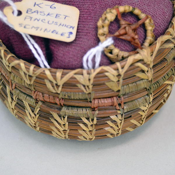 Pincushion- Basket Seminole Style makes a charming vintage addition to any sewing collection or display. stands 2.25 inches tall and 3.5 inches wide. Pictured here is the side of the basket and the top,