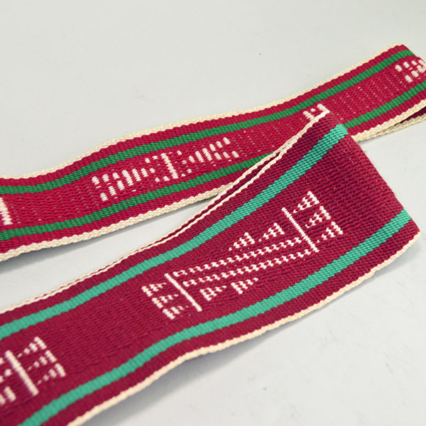 Add vibrant style to your dance regalia with this handwoven Sash- Hopi Style Set of two. 49 inches long by 3 inches wide, 47.5 inches long by 2 inches wide. Pictured here is a up close of the design and colors.