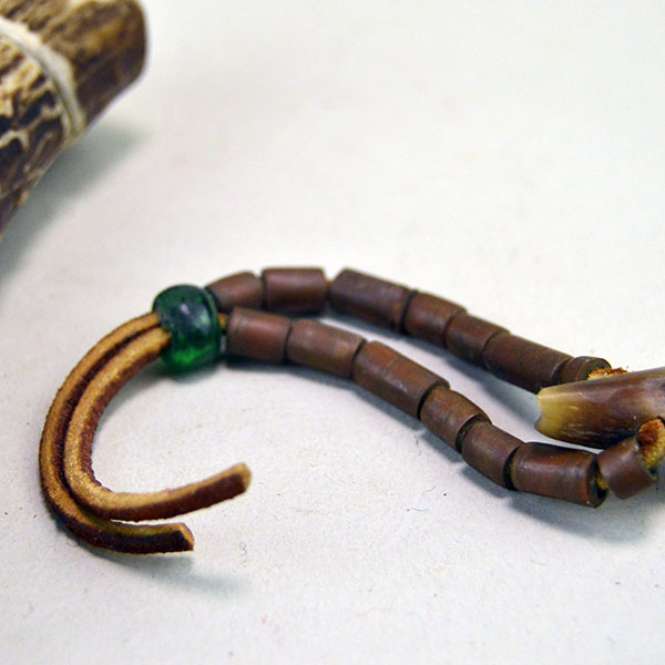 Antler and horn utility lot, ideal for artisans, collectors, and makers. The horn scoop measures 5.5" by 1.25". antler case with top measures 6" x 1.5" wide. pictured here is the brass tile beads on the horn scoop.