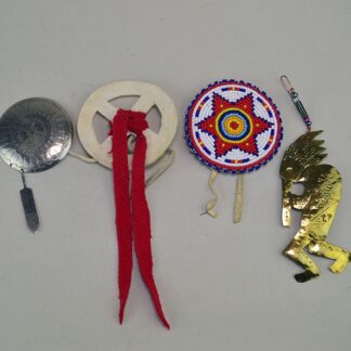 group lot offers a striking mix of accessories. beaded rosette star, bone cutout pendant, stamped brass Kokopelli, and stamped German silver concho.