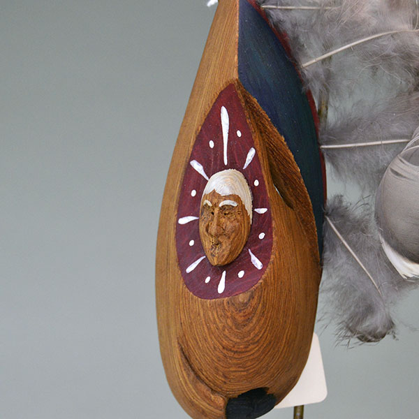 Masks- 2 Pieces set features lightweight wood masks, each hand‑carved, one carved face, and other raised face carved directly into the wood. pictured here is the mask with the carved face.