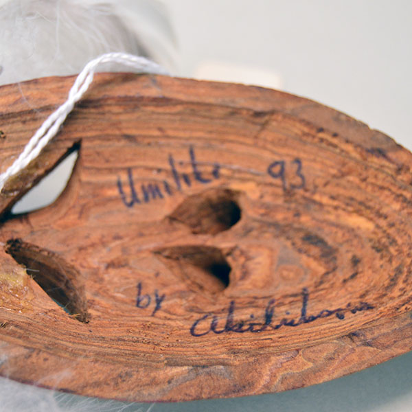 Masks- 2 Pieces set features lightweight wood masks, each hand‑carved, one carved face, and other raised face carved directly into the wood. pictured here is the back with umilile 93 and crafters signature.