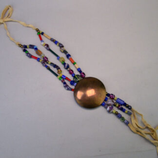 Necklace- Concho & Trade Beads delivers a strong, handcrafted look built around a 3‑inch brass concho. necklace measures 24 inches long.