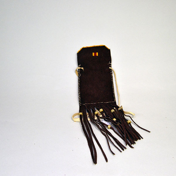 Pouch- Dark Brown Deerskin delivers standout craftsmanship. measures approx. 5″ x 4″. 3″ x 3.25″ beaded panel design on the front. One of a Kind. pictured here is the back of the pouch show casing the dark brown deerskin.