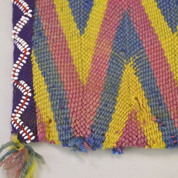 vintage Bag- Wool Yarn Fingerwoven features a soft cotton lining. measures 10" wide by 14" long. few small areas of yarn show age‑related deterioration. pictured here looks like some thing was at the bottom of the bag and has come off.