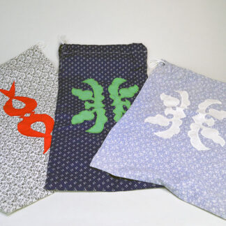 Bags- Three Cotton Lot offers handcrafted pieces. white bag (17.25" x 11"). light blue bag (16" x 10.75"). navy blue bag (18" x 9.75"). one of a kind.