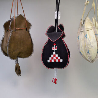 Bags- Tulip Style, black bag bold red‑and‑white seed‑bead design. brown bag with silver cut seed beads. white bag light‑blue and white beaded edging.