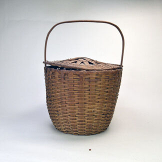 Antique Hand‑woven Basket- Ash With Slide over Lid, with sturdy wooden handle. stands 8.5" tall and 10.5" wide, Handle rises 6 inches above the rim.