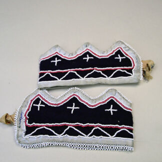 Vintage beaded cuff set, measure 12 inches long by 3 inches wide. 11/0 white and white‑center red seed‑bead pattern on both. One of a Kind.