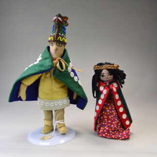 Dolls—Kwakiutl dancers, one girl and one boy—wear traditional regalia. The boy measures 12" tall , and the girl measures 8" tall. One of a Kind.