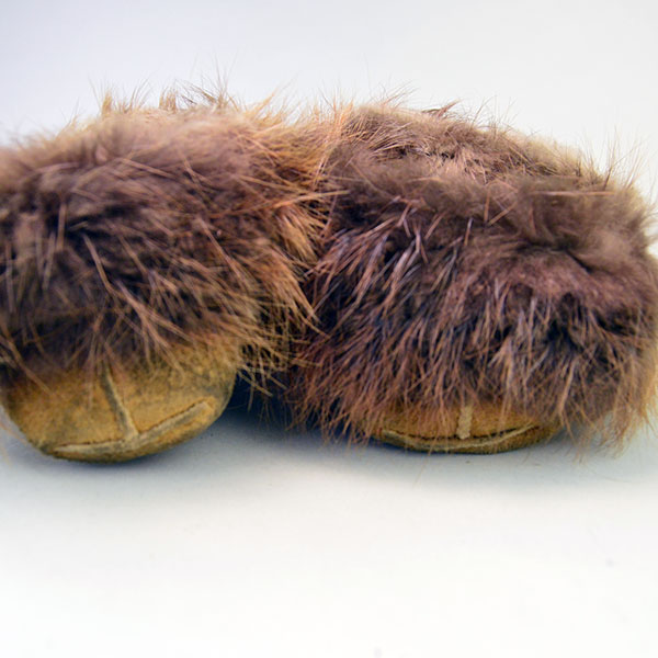 hand‑crafted Cree smoked‑moosehide moccasins showcase classic Cree styling. vibrant floral beadwork design adorns the vamp. beaver fur to the cuffs. pictured here is the beaver fur cuffs.