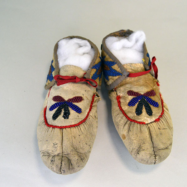 vintage Moccasins- Cree Style Youth in the 1940s to 1950s using brain‑tanned deer hide and a center‑seam construction. Beaded vamp and cuffs. one of a Kind.
