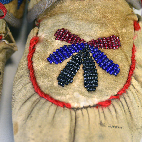 vintage Moccasins- Cree Style Youth in the 1940s to 1950s using brain‑tanned deer hide and a center‑seam construction. Beaded vamp and cuffs. one of a Kind. beaded vamp.