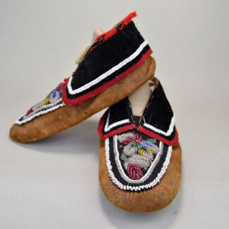 Early 20th Century Moccasins- Iroquois Style Antique to your collection. raised Floral beadwork design to the vamps. some of the stitching has come apart. 