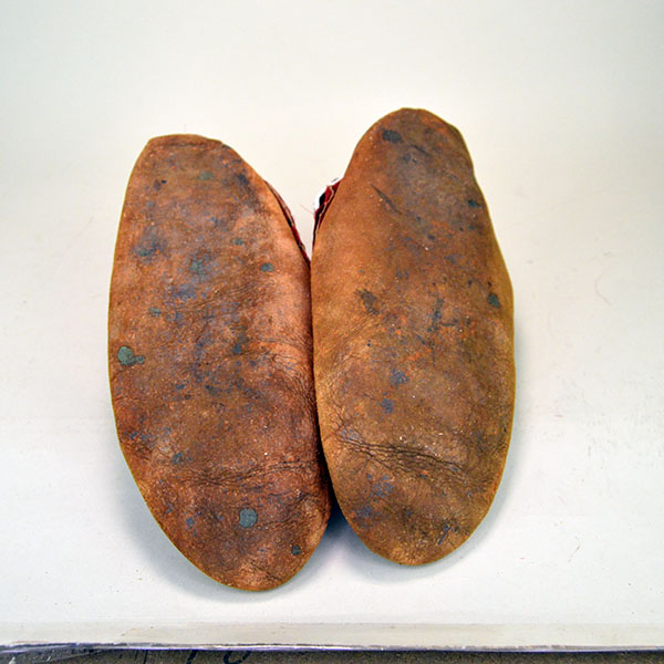 Early 20th Century Moccasins- Iroquois Style Antique to your collection. raised Floral beadwork design to the vamps. some of the stitching has come apart. the soles.