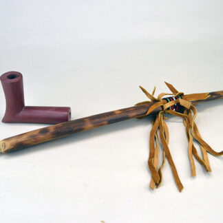 Pipe- Catlinite Elbow Shaped would be an impressive addition to your collection. Hand carved pipe measures 21" overall. one of a kind.